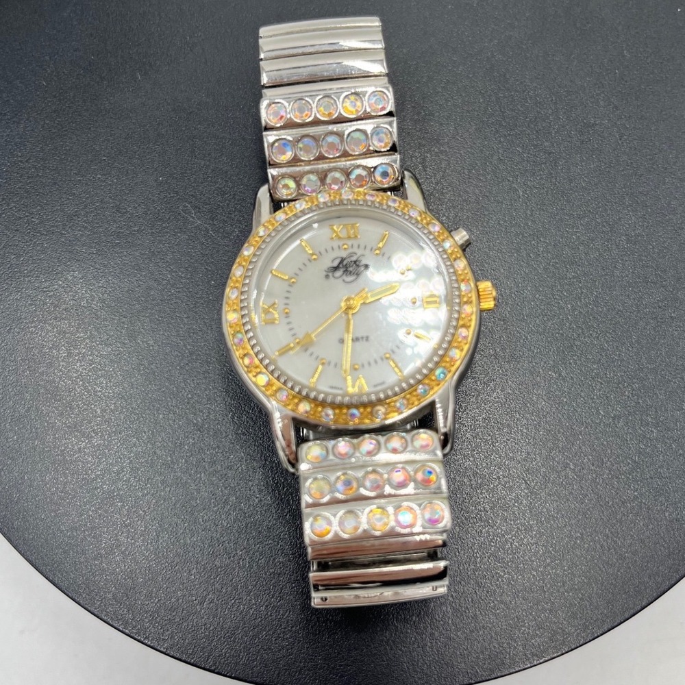Kirks Folly Quartz Woman's Gold Tone Iridescent Stone Embellished
Stretchy Watch